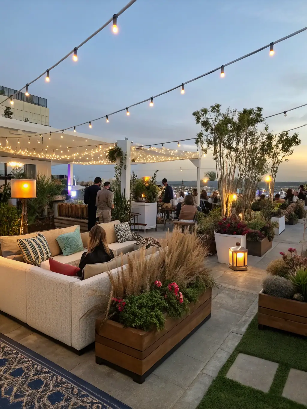 A wide shot of The Spot's outdoor lounge, showcasing the layout, design, and overall ambiance of the space, including plants and decorative elements.